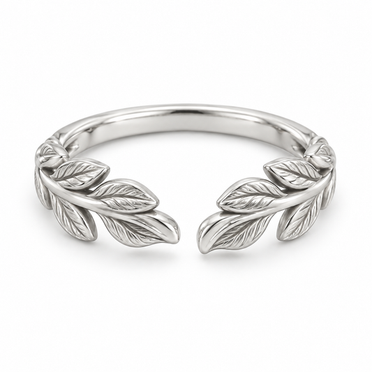 [metal:white-gold] Juniper Laurel Ring — front — Open engraved laurel-leaf band, shallow front studio view [catalog-v4]