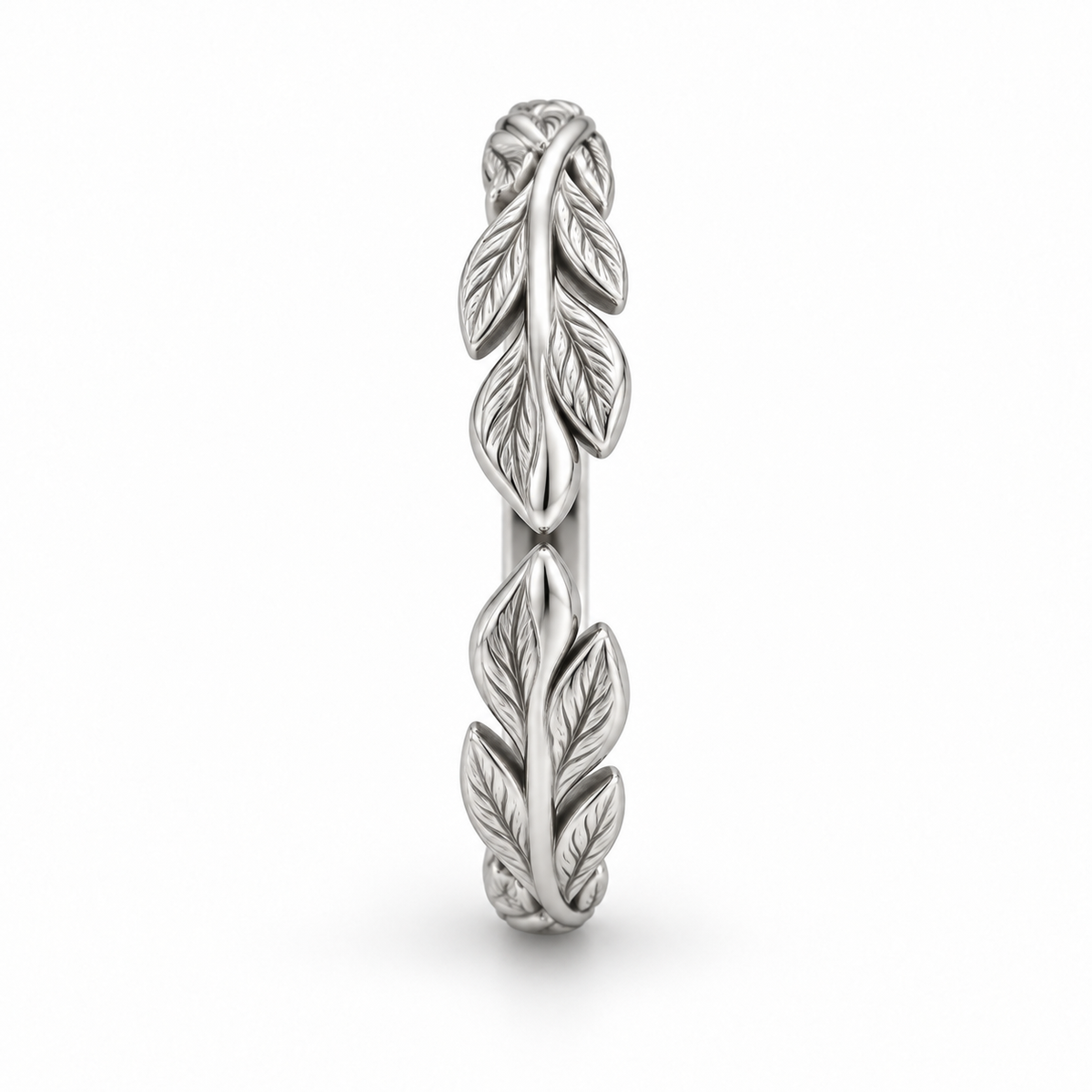 [metal:white-gold] Juniper Laurel Ring — side-profile — Open engraved laurel-leaf band, edge profile studio view [catalog-v4]