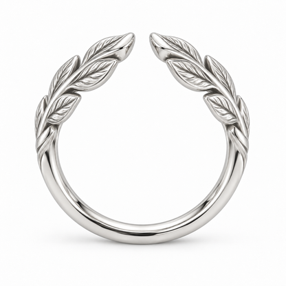 [metal:white-gold] Juniper Laurel Ring — top — Open engraved laurel-leaf band, circular elevation studio view [catalog-v4]