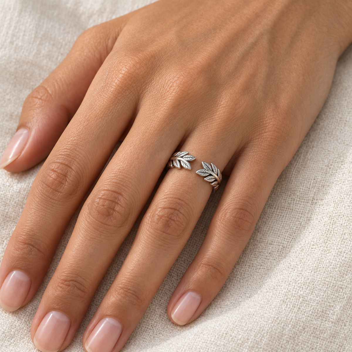 [metal:all] Juniper Laurel Ring — worn — Human-worn styling illustration [catalog-v4]