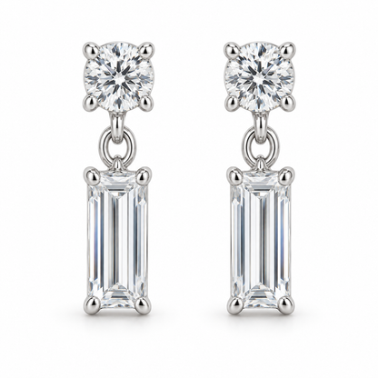 [metal:white-gold] Leonie Baguette Drop Earrings — front — one small round diamond stud above one vertical baguette diamond drop on each earring, front view [catalog-v4]