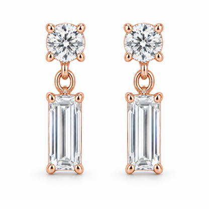 [metal:rose-gold] Leonie Baguette Drop Earrings — front — one small round diamond stud above one vertical baguette diamond drop on each earring, front view [catalog-v4]