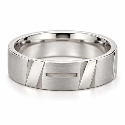 [metal:white-gold] Maelor Facet-Slot Band — front — Mens closed continuous 6 mm wide band with alternating broad flat satin rectangular planes and short polished diagonal bevel planes around outer circumference. One narrow shallow rectangular recessed slot at centre front only, not a through-hole. Smooth circular comfort-fit inner bore. No stones. [catalog-v4]