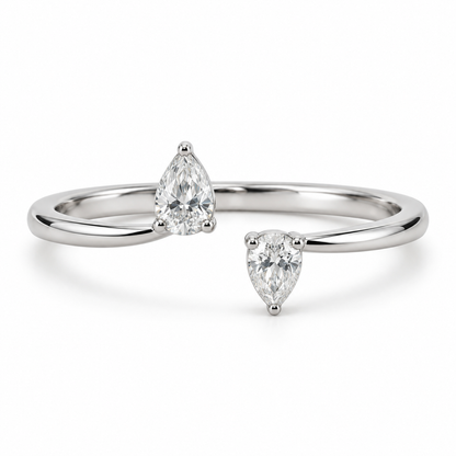 [metal:white-gold] Maribel Pear Duo Ring — front — slender open polished ring with two modest pear diamonds at opposing tips, one pear points up other down, front view [catalog-v4]