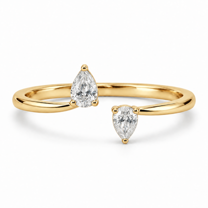 [metal:yellow-gold] Maribel Pear Duo Ring — front — slender open polished ring with two modest pear diamonds at opposing tips, one pear points up other down, front view [catalog-v4]