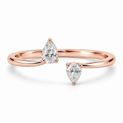[metal:rose-gold] Maribel Pear Duo Ring — front — slender open polished ring with two modest pear diamonds at opposing tips, one pear points up other down, front view [catalog-v4]