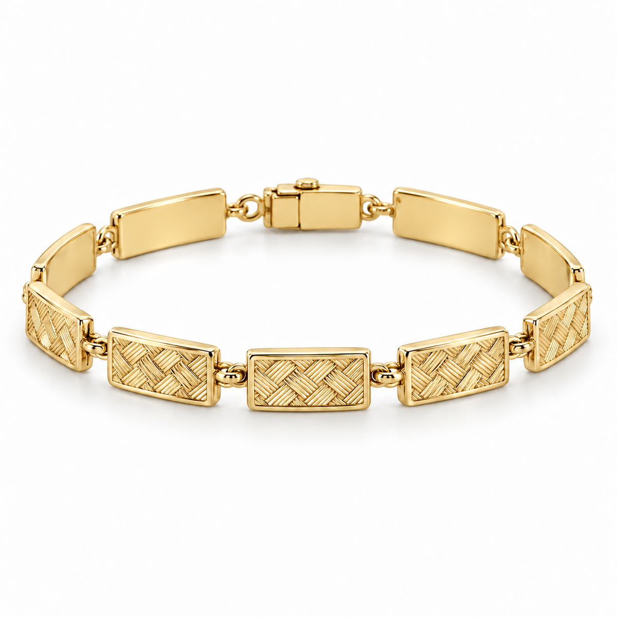 [metal:yellow-gold] Miravelle Woven-Panel Bracelet — front — Articulated bracelet of exactly seven short solid rectangular panels. Each panel has a low relief engraved diagonal basket-weave pattern, smooth polished border and plain back, joined by simple short oval links. Low box clasp at rear. No diamonds. [catalog-v4]