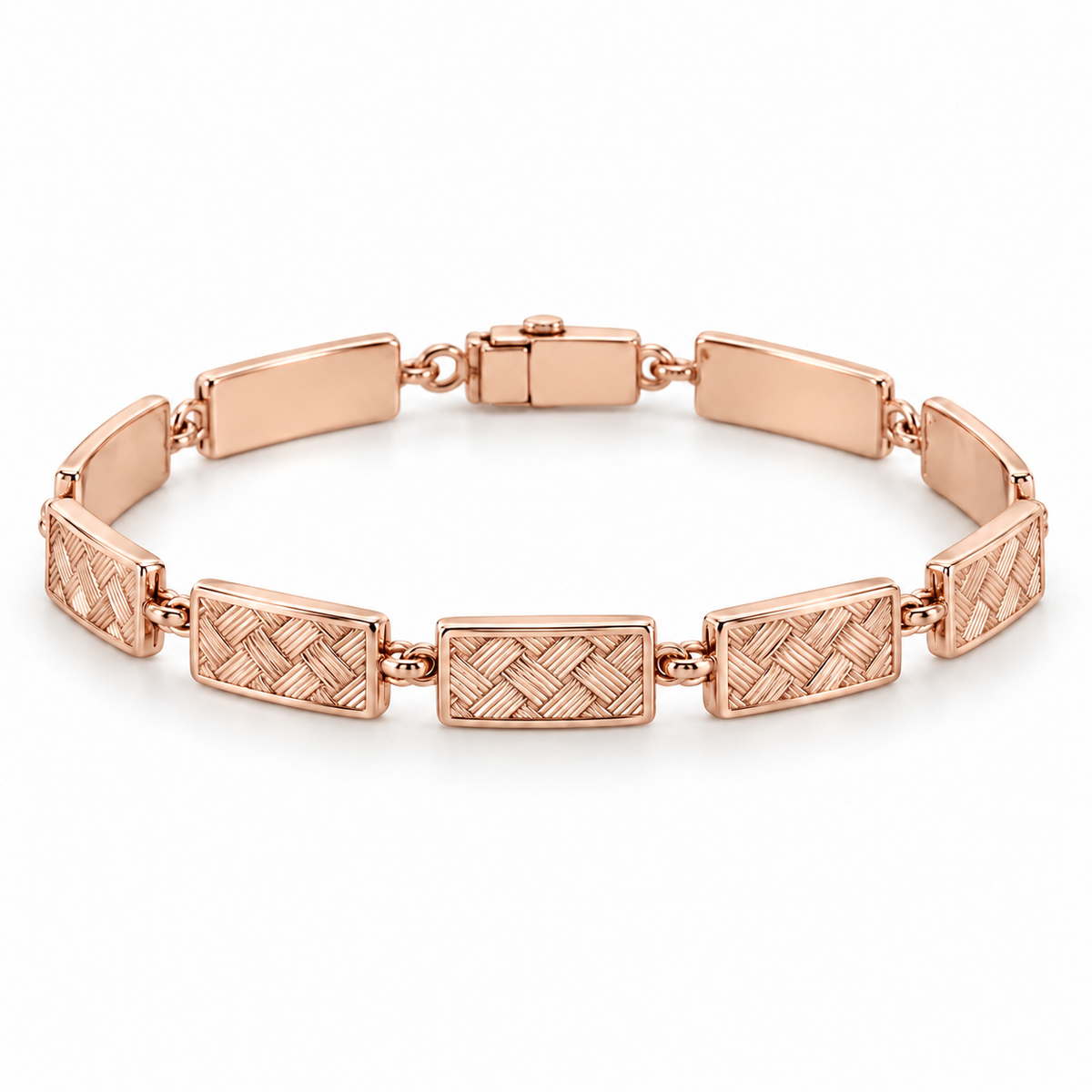 [metal:rose-gold] Miravelle Woven-Panel Bracelet — front — Articulated bracelet of exactly seven short solid rectangular panels. Each panel has a low relief engraved diagonal basket-weave pattern, smooth polished border and plain back, joined by simple short oval links. Low box clasp at rear. No diamonds. [catalog-v4]