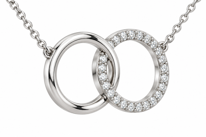 [metal:white-gold] Mirelle Double Circle Necklace — three-quarter — two small interlocking circular pendants one plain polished and one fine round-diamond pave, fine chain attached at upper outer sides, three-quarter view [catalog-v4]