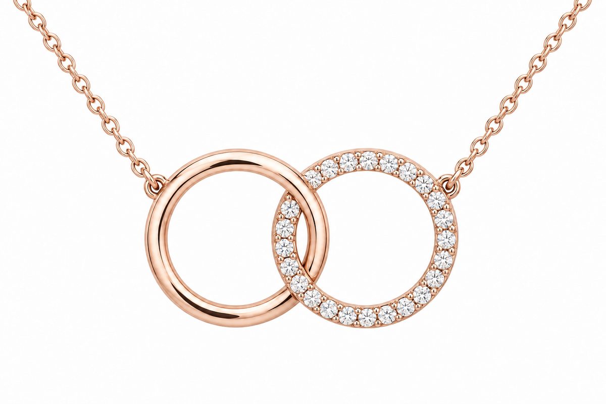 [metal:rose-gold] Mirelle Double Circle Necklace — front — two small interlocking circular pendants one plain polished and one fine round-diamond pave, fine chain attached at upper outer sides, front view [catalog-v4]