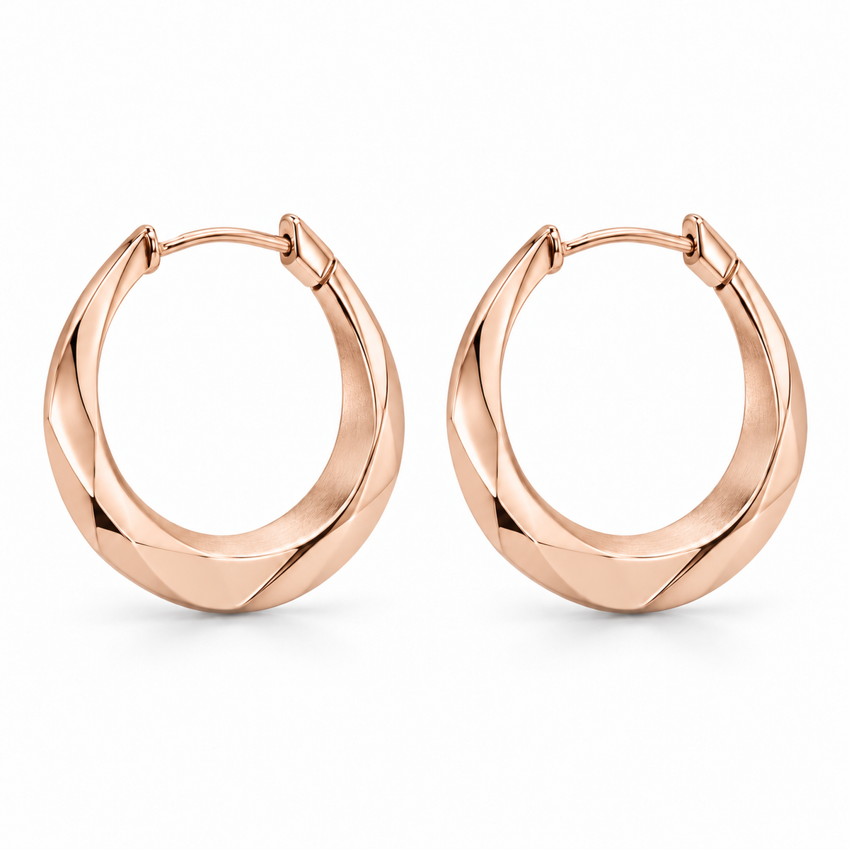 [metal:rose-gold] Naverie Facet Crescent Hoops — front — Matching pair of small hinged crescent hoops with solid triangular faceted metal cross-section, narrow at ends and broader along lower front arc. Polished exterior facets, satin inner facet, hinged rear latch. No stones, no open front gap when closed. [catalog-v4]