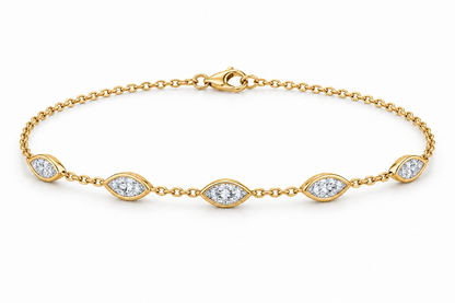 [metal:yellow-gold] Nerida Marquise Station Bracelet — front — fine cable-chain bracelet with exactly five spaced east-west marquise diamond bezel stations, front view [catalog-v4]