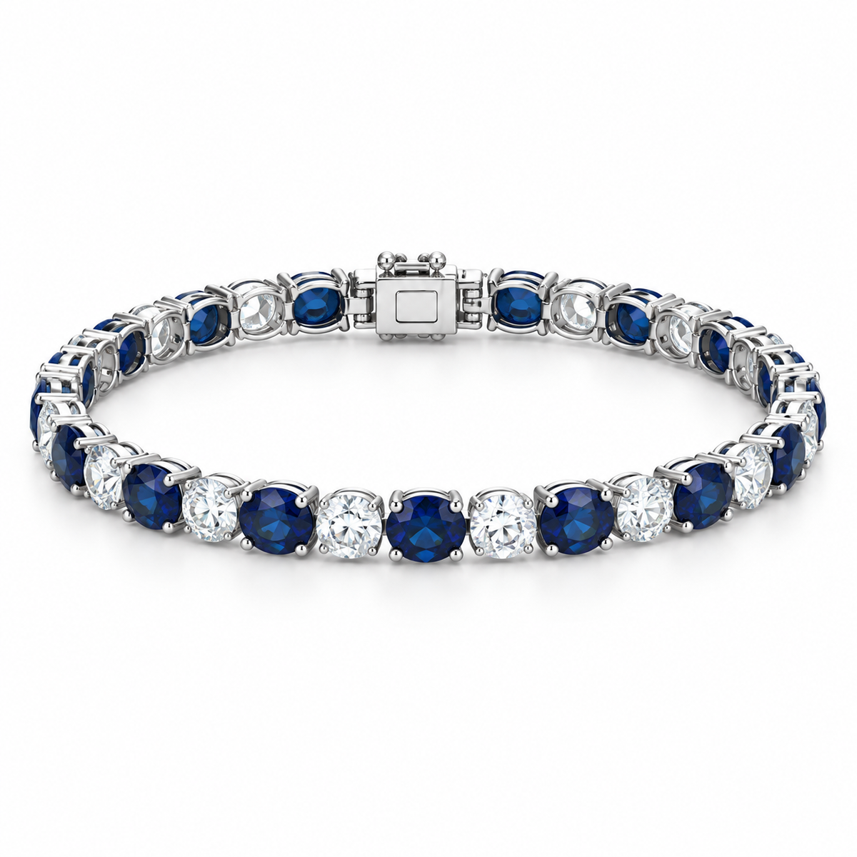[metal:white-gold] Noelle Sapphire Tennis Bracelet — front — Alternating sapphire and diamond tennis bracelet, low oblique studio view [catalog-v4]