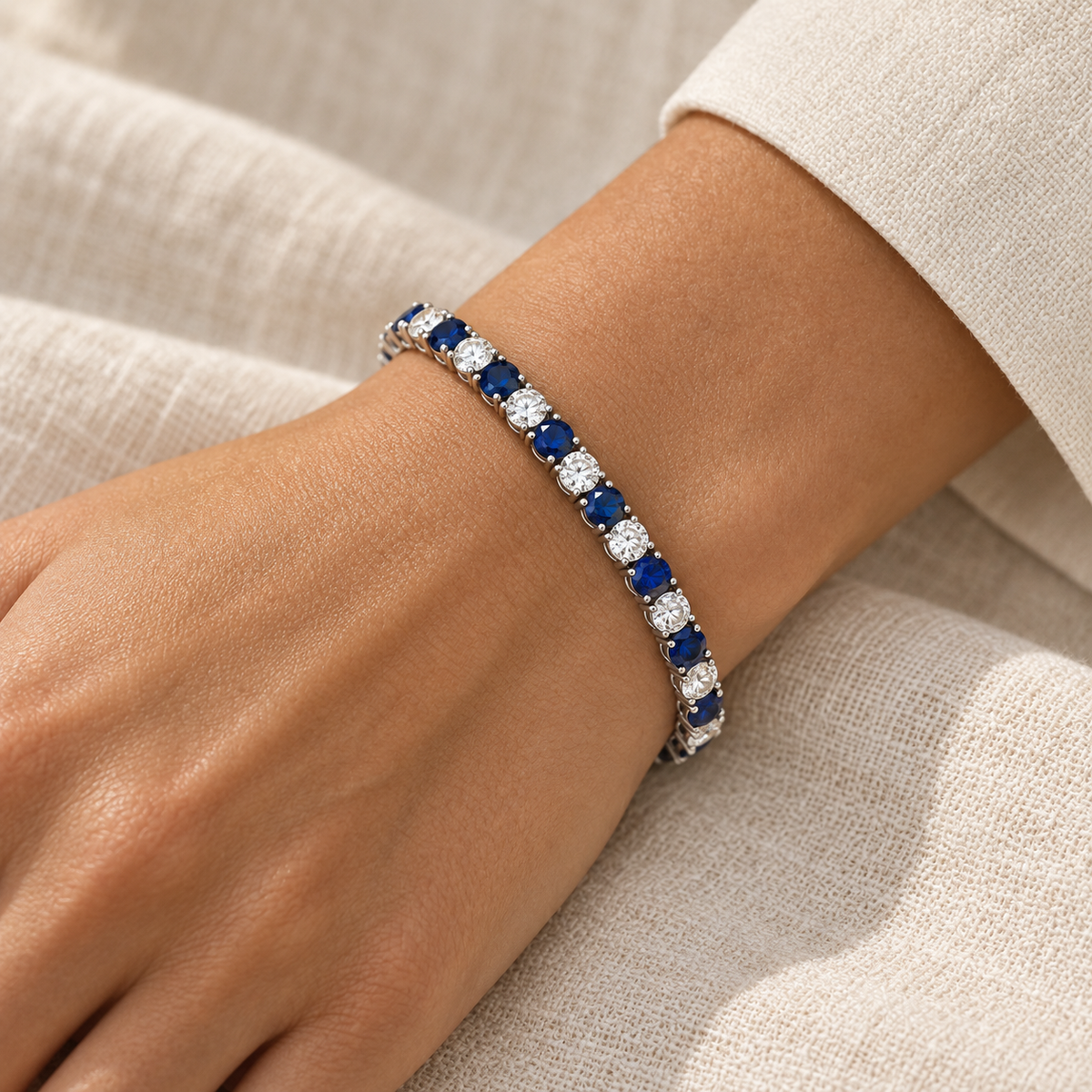 [metal:all] Noelle Sapphire Tennis Bracelet — worn — Human-worn styling illustration [catalog-v4]