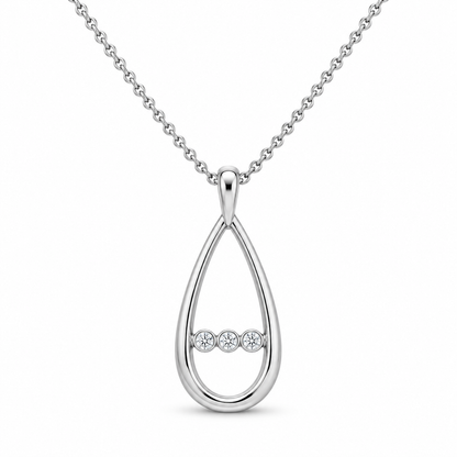 [metal:white-gold] Nymelle Raindrop Bridge Necklace — front — One vertical open polished elongated teardrop frame, with exactly three tiny round diamonds flush-set in a short horizontal metal bridge crossing its lower third. Fine chain attached to small upper bail. Not a diamond teardrop centre. [catalog-v4]
