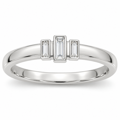 [metal:white-gold] Olivienne Baguette Crown Band — front — Womens closed continuous narrow straight wedding band with exactly three north-south baguette diamonds in three slim separate rectangular bezels across top, centre baguette slightly raised and longer, two smaller flanking baguettes, all upright parallel. Plain smooth lower band. No round diamonds. [catalog-v4]