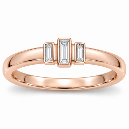 [metal:rose-gold] Olivienne Baguette Crown Band — front — Womens closed continuous narrow straight wedding band with exactly three north-south baguette diamonds in three slim separate rectangular bezels across top, centre baguette slightly raised and longer, two smaller flanking baguettes, all upright parallel. Plain smooth lower band. No round diamonds. [catalog-v4]