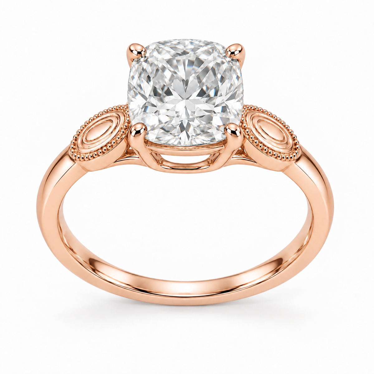 [metal:rose-gold] Ophira Cartouche Solitaire Setting — front — One cushion centre in four corner claws in a compact open basket. At each shoulder a single small solid polished oval cartouche inset with engraved concentric oval lines, no stones. Cartouches lie flat along the top of the shank, merge into one slim plain band. Fine bead border on cartouches only, open U bridge beneath centre. [catalog-v4]