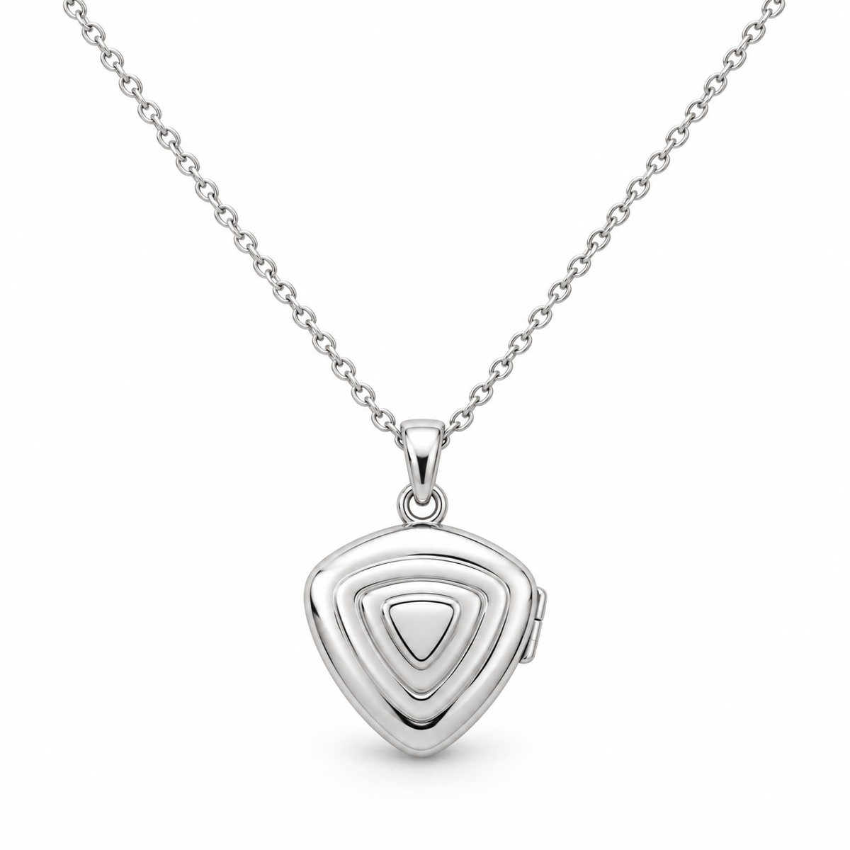 [metal:white-gold] Orelisse Ripple Locket Necklace — front — One small closed rounded-triangle locket with three shallow concentric rounded-triangle ripples on its front, smooth back, discreet hinge on right edge and a small simple round bail. Fine cable chain. No engraving or stones. [catalog-v4]