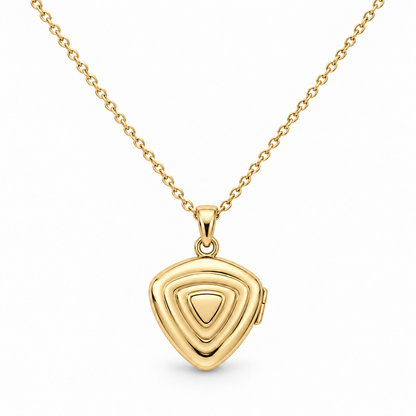 [metal:yellow-gold] Orelisse Ripple Locket Necklace — front — One small closed rounded-triangle locket with three shallow concentric rounded-triangle ripples on its front, smooth back, discreet hinge on right edge and a small simple round bail. Fine cable chain. No engraving or stones. [catalog-v4]