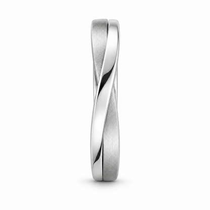 [metal:white-gold] Orielle Ribbon Crossover Ring — side-profile — two flat white gold ribbons crossing asymmetrically, one satin one polished, sculptural low-profile crossover ring no stones, side-profile view [catalog-v4]