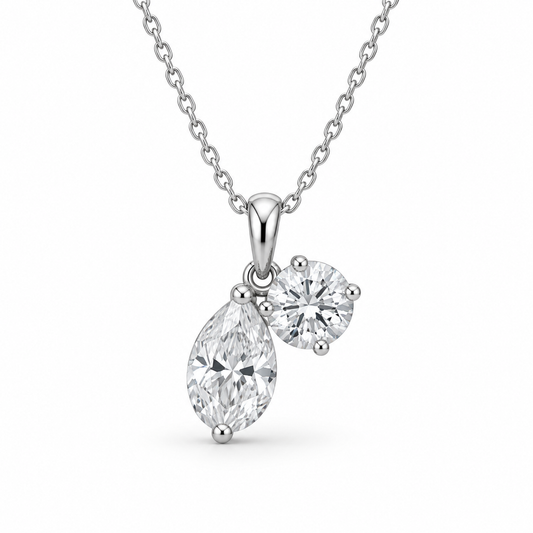 [metal:white-gold] Rosamund Toi et Moi Necklace — front — Pear and round diamond pendant, front studio view [catalog-v4]