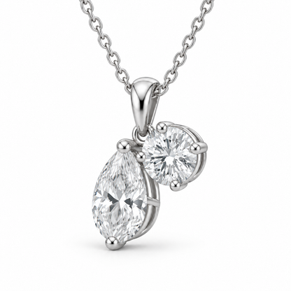 [metal:white-gold] Rosamund Toi et Moi Necklace — three-quarter — Pear and round diamond pendant, oblique studio view [catalog-v4]