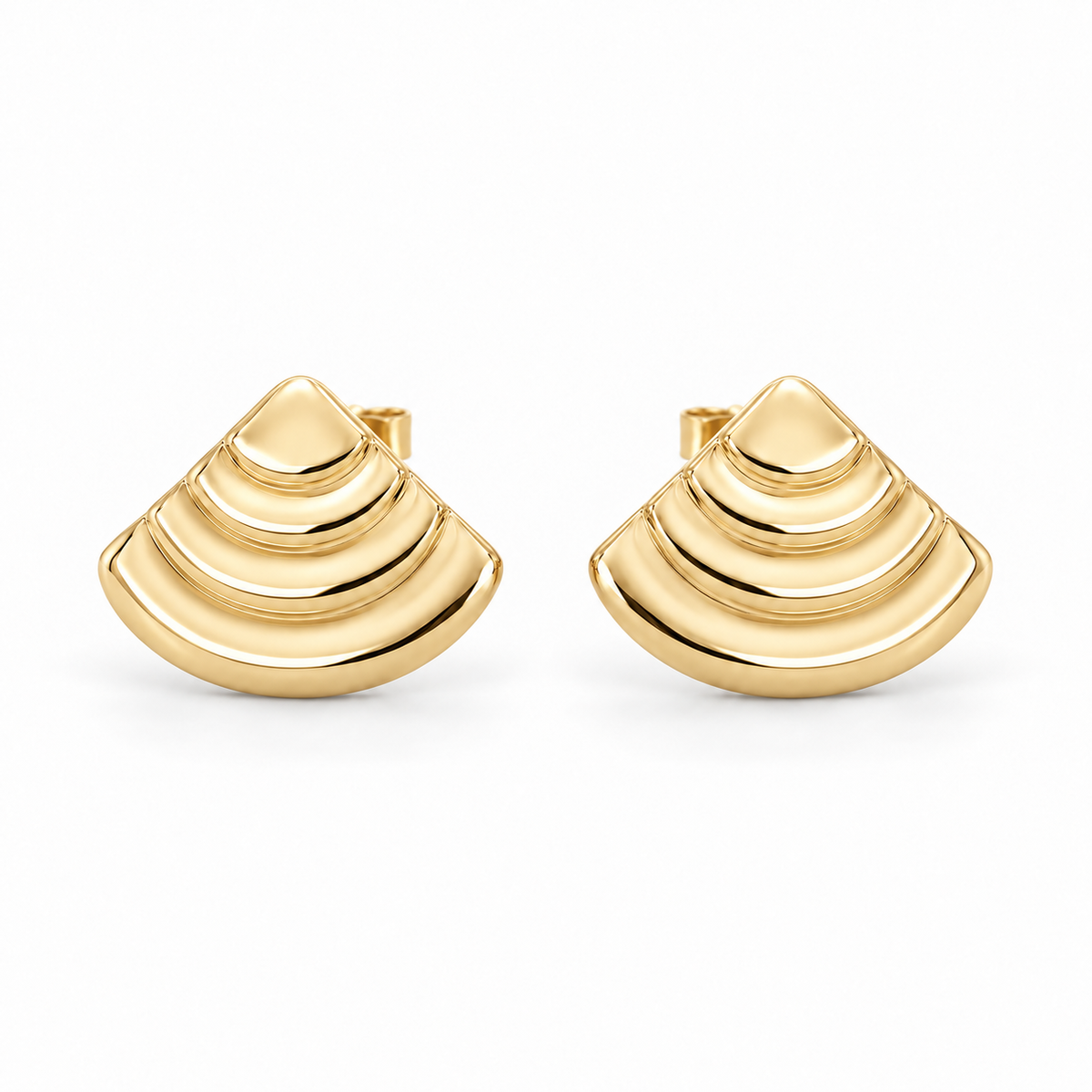 [metal:yellow-gold] Rovelle Stepped Shell Studs — front — Matching pair of shallow domed fan-shell metal studs, each shell has exactly four broad concentric stepped arc terraces, smooth rounded lower edge and no radial pleats. Straight rear post and butterfly back. No diamonds. [catalog-v4]
