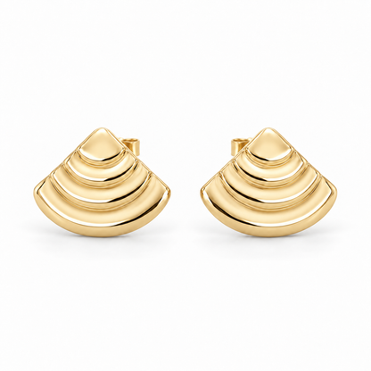 [metal:yellow-gold] Rovelle Stepped Shell Studs — front — Matching pair of shallow domed fan-shell metal studs, each shell has exactly four broad concentric stepped arc terraces, smooth rounded lower edge and no radial pleats. Straight rear post and butterfly back. No diamonds. [catalog-v4]
