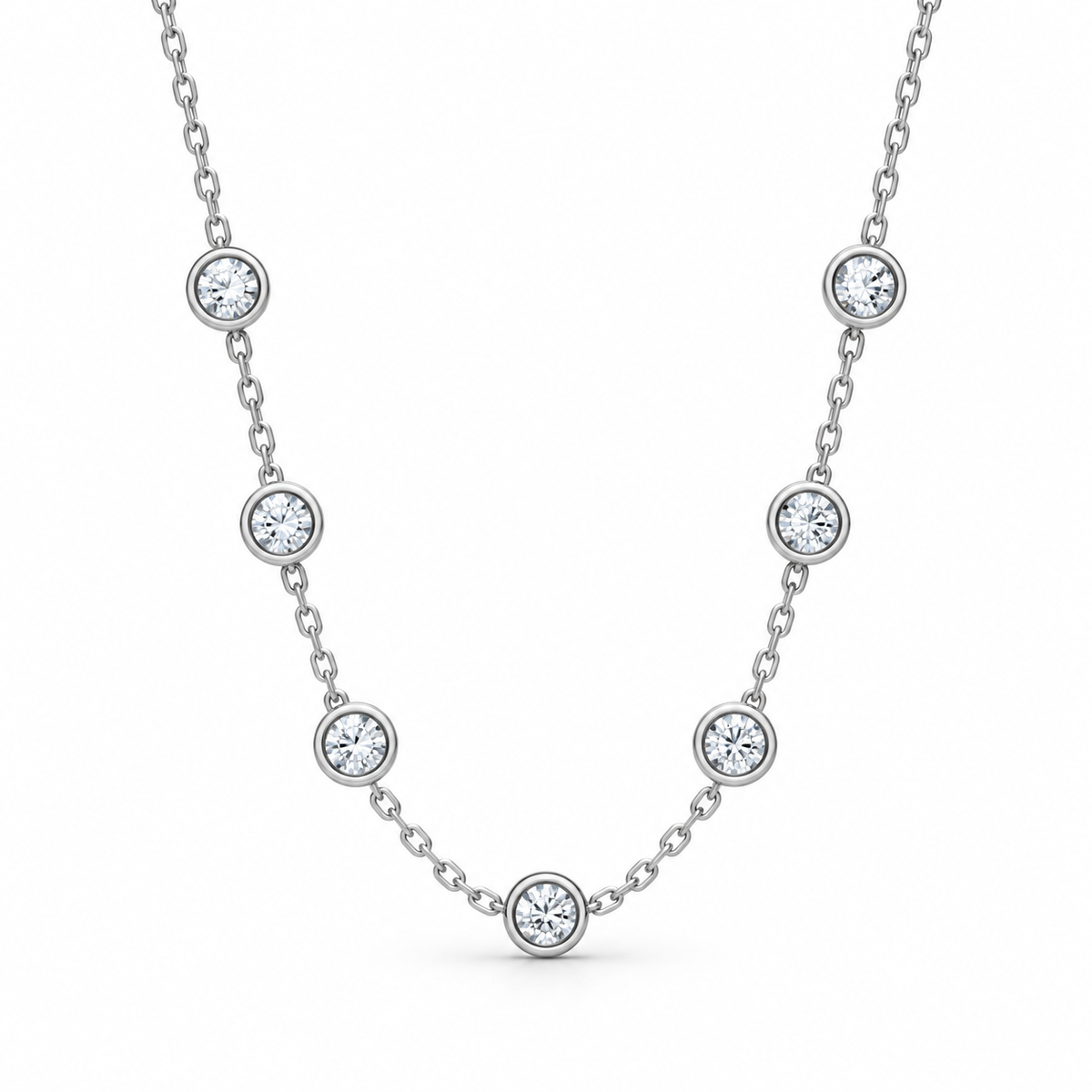 [metal:white-gold] Serenade Station Necklace — front — Seven bezel diamond stations, front studio view [catalog-v4]