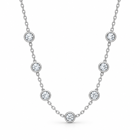 [metal:white-gold] Serenade Station Necklace — front — Seven bezel diamond stations, front studio view [catalog-v4]