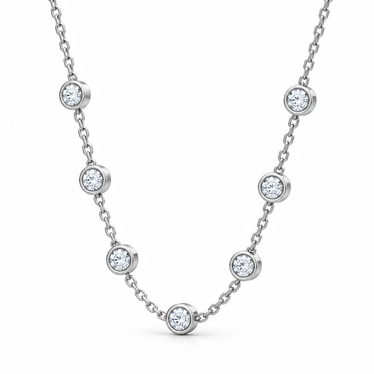 [metal:white-gold] Serenade Station Necklace — three-quarter — Seven bezel diamond stations, oblique studio view [catalog-v4]