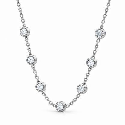 [metal:white-gold] Serenade Station Necklace — three-quarter — Seven bezel diamond stations, oblique studio view [catalog-v4]