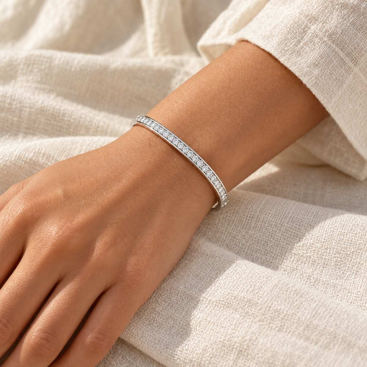 [metal:all] Solenne Bangle — worn — Human-worn styling illustration [catalog-v4]