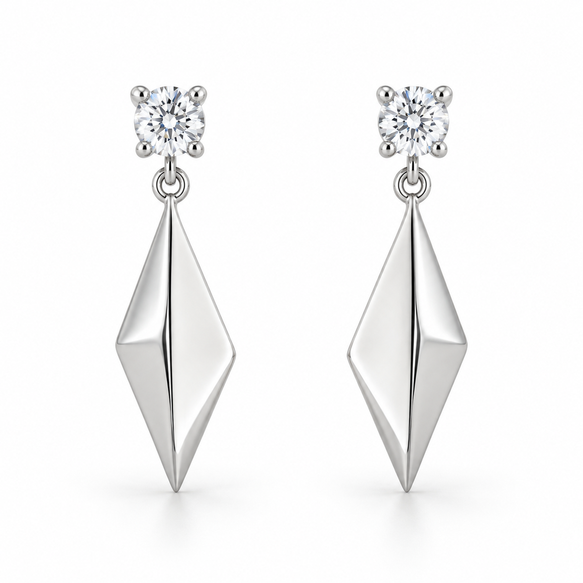 [metal:white-gold] Solivelle Kite Drop Earrings — front — Matching pair: each earring has one small round diamond stud in a four-claw basket, one tiny articulating jump ring and one solid polished asymmetric kite-shaped metal drop with a single folded central ridge. No diamonds on kite. Straight post and butterfly back. [catalog-v4]