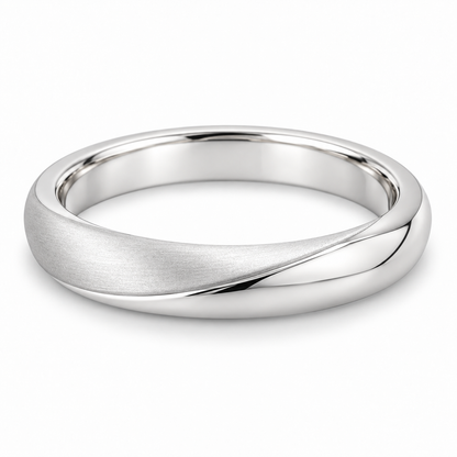 [metal:white-gold] Vaelisse Satin Fold Band — front — Womens slim 3 mm closed continuous wedding band with one shallow off-centre soft fold crest at front, one face satin and opposite face polished. Low smooth rounded ridge, no twists, no crossing strands, smooth circular comfort-fit interior. No diamonds. [catalog-v4]