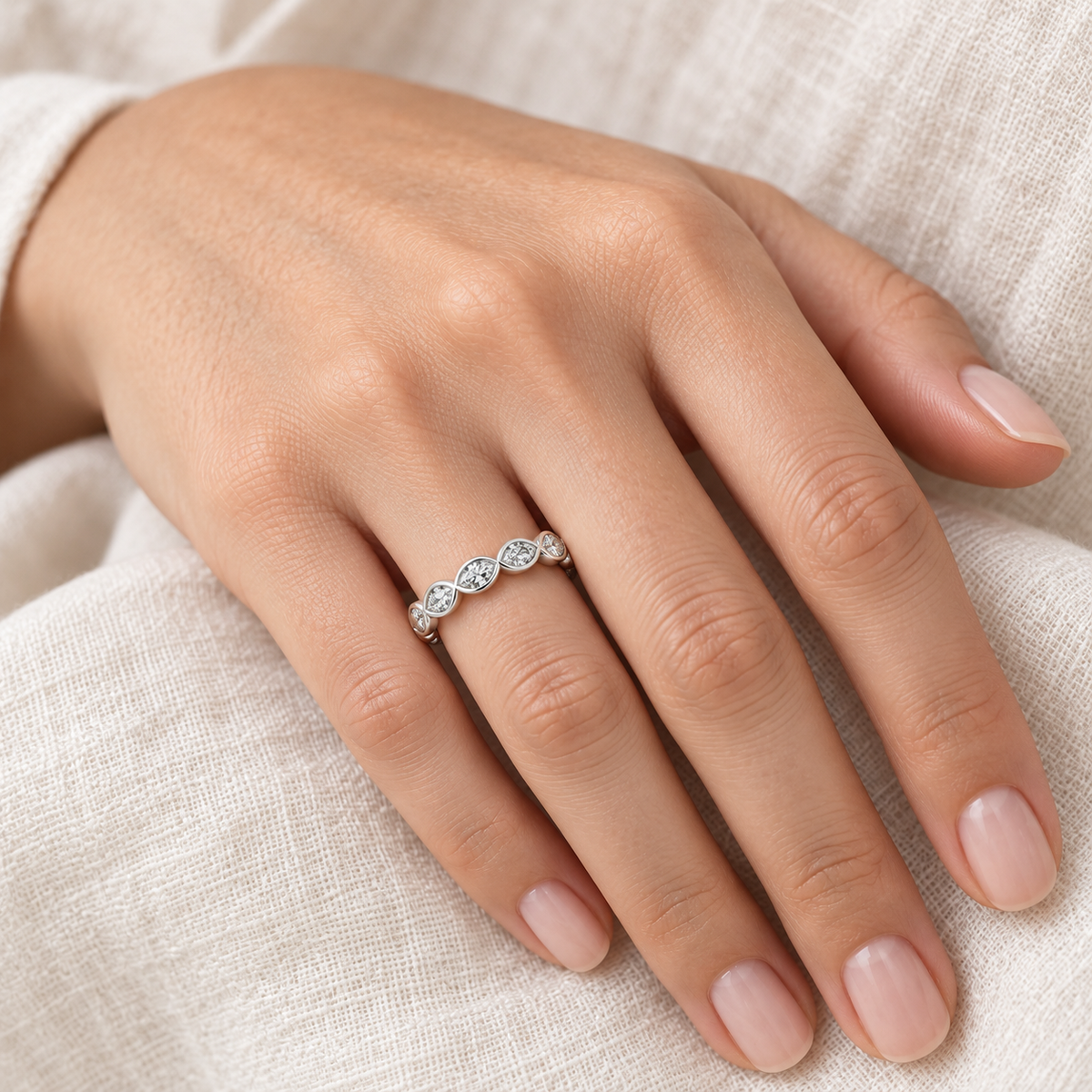 [metal:all] Yselle Marquise Bezel Eternity Ring — worn — Human-worn styling illustration [catalog-v4]