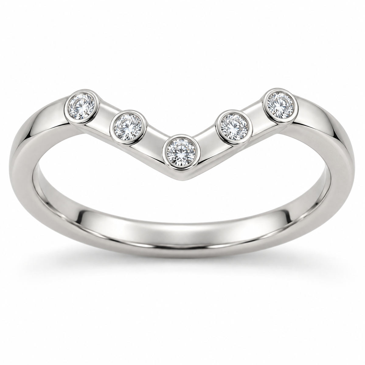 [metal:white-gold] Zerielle Five-Bezel Chevron Band — front — Womens closed continuous narrow chevron nesting band. Exactly five small round diamonds in five individual full circular bezels spaced evenly along the shallow V top, central bezel at V point and two on each arm. Plain smooth lower shank, no extra stones. [catalog-v4]