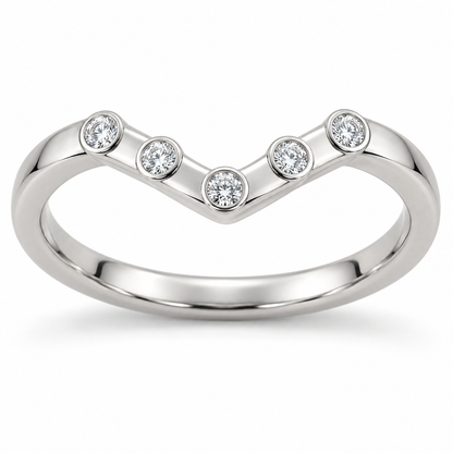 [metal:white-gold] Zerielle Five-Bezel Chevron Band — front — Womens closed continuous narrow chevron nesting band. Exactly five small round diamonds in five individual full circular bezels spaced evenly along the shallow V top, central bezel at V point and two on each arm. Plain smooth lower shank, no extra stones. [catalog-v4]